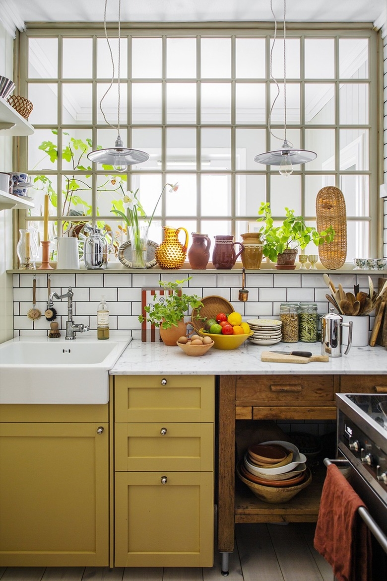 Kitchen Cabinetry with Glass Partition: eclectic farmhouse sink area