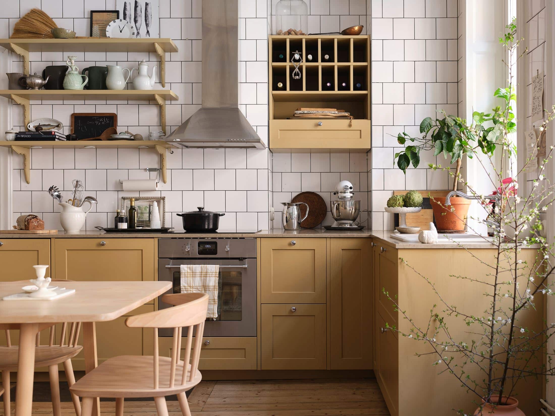 Kitchen Cabinetry with Grid Tiling: yellow scandinavian kitchen