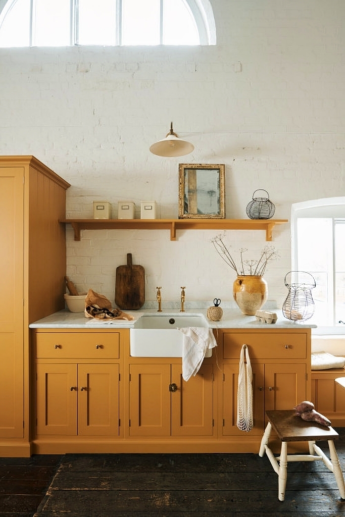 Kitchen Cabinetry with White Brick: mustard yellow farmhouse kitchen