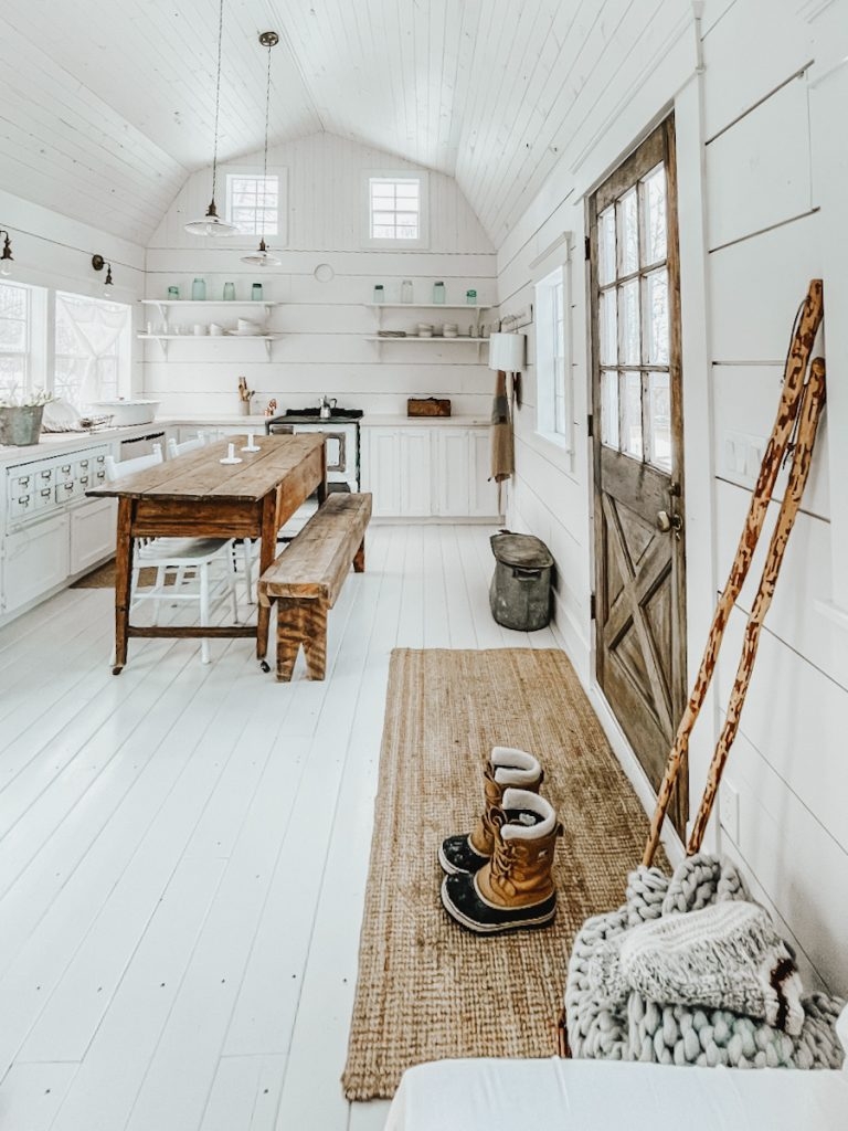Kitchen Dining Combo with White Plank Walls: rustic wood dining table.