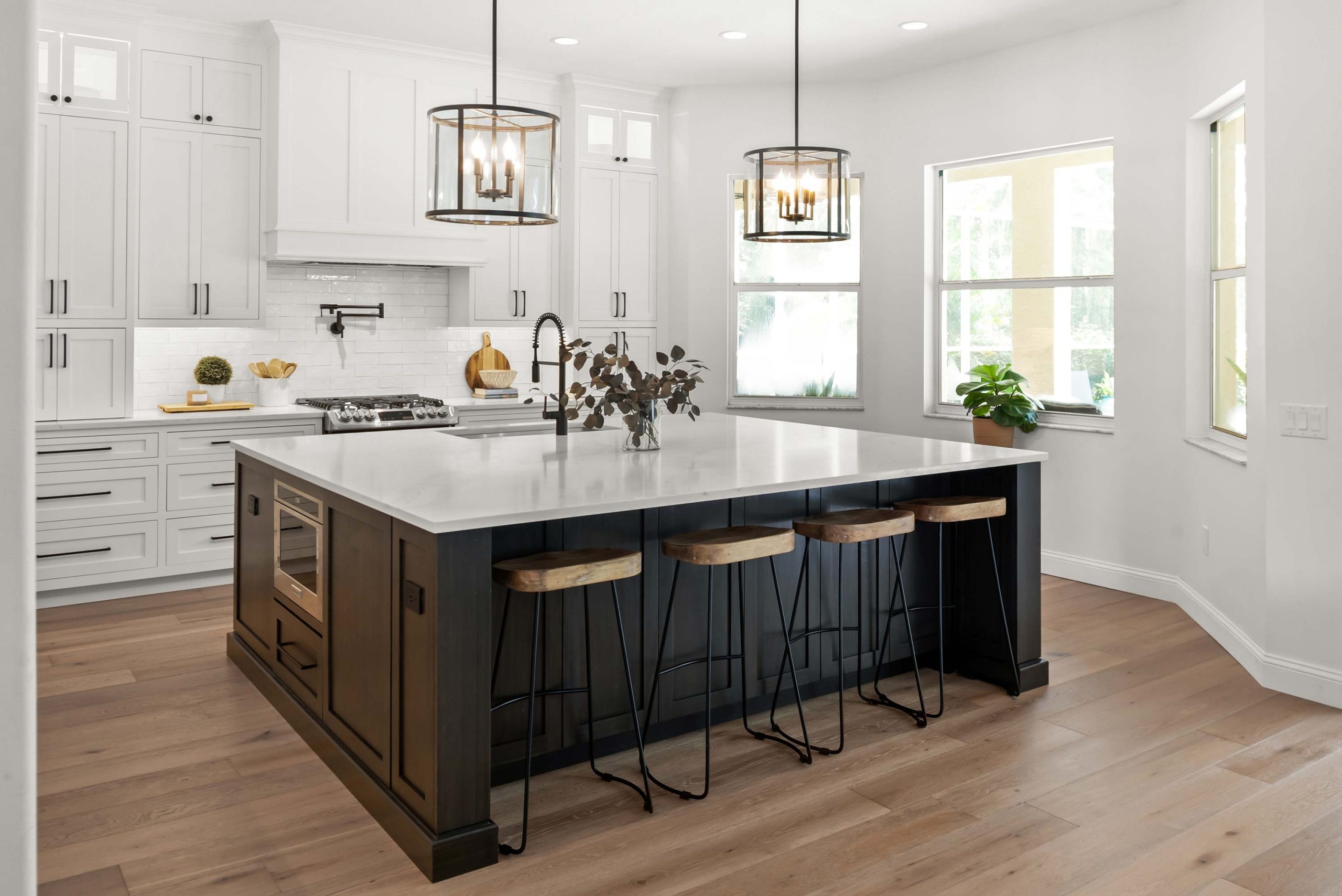 Kitchen Island Design with Lantern Lighting and Wood Toned Stools