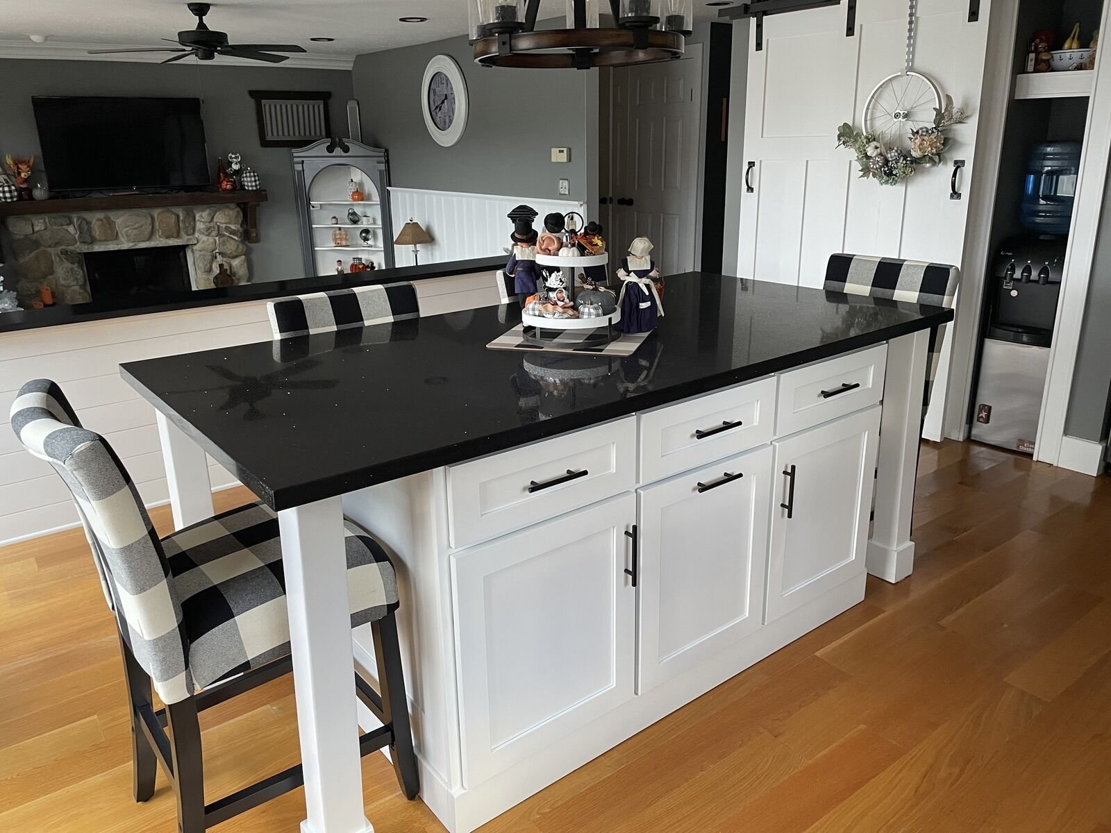 Kitchen Island Showcasing Black Quartz Top and Buffalo Check Stools
