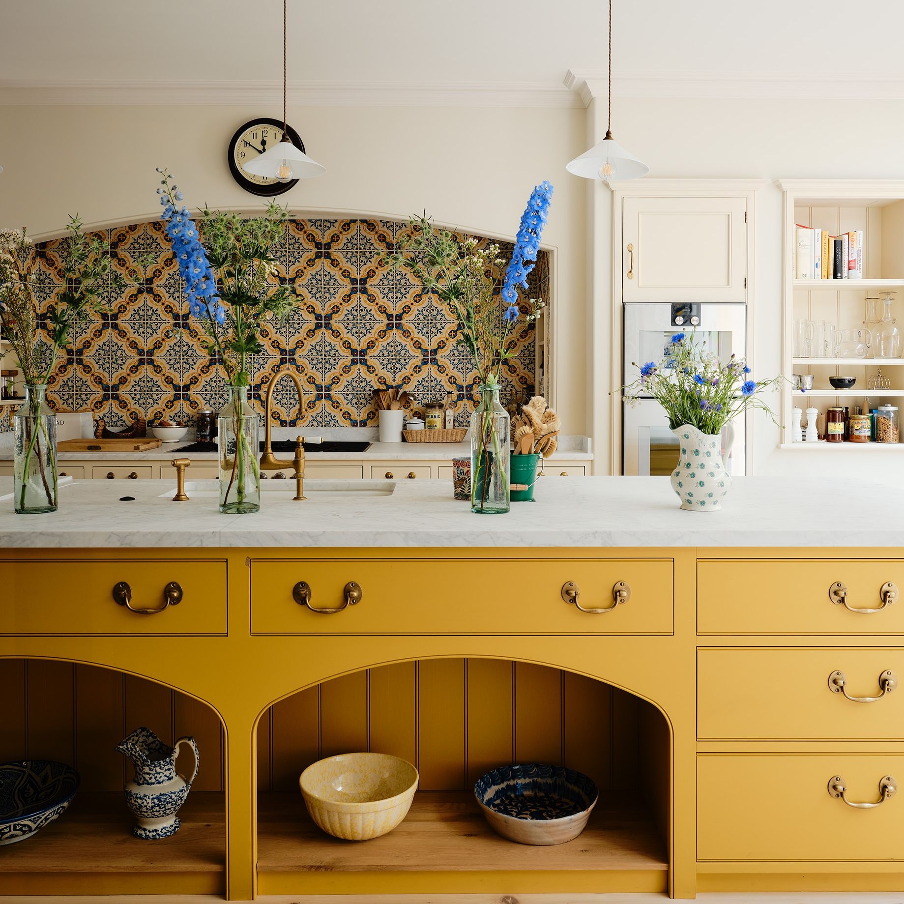 Kitchen Island with Arched Shelving: mustard yellow kitchen island