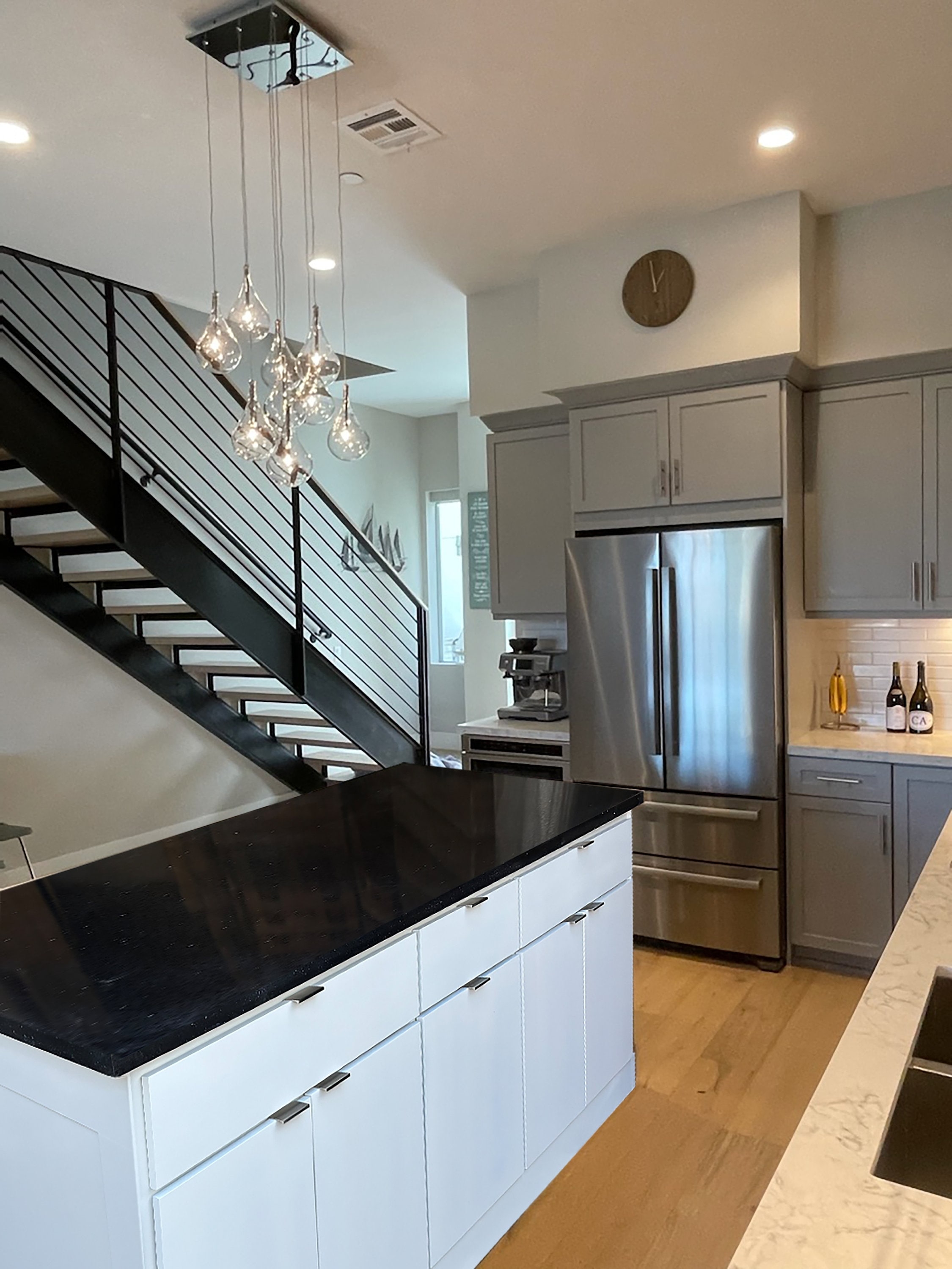 Kitchen Island with Slim Hardware and Glass Droplet Pendants