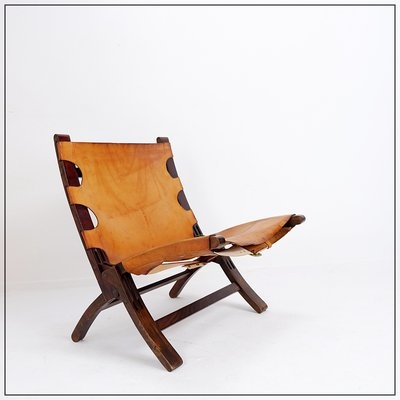 Lounge Chair with Cutout Leather Sling and Walnut Wood