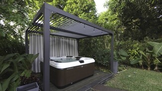 Louvered Pergola with Hanging Edison Bulbs Luxury Spa Lighting