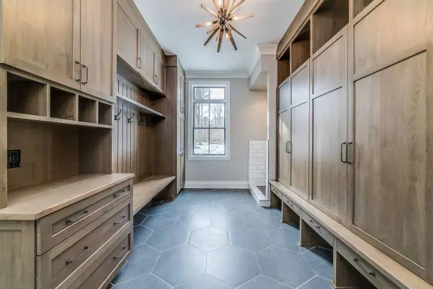 Mudroom Cabinetry: Hexagonal Slate Floor and Wood Built-Ins