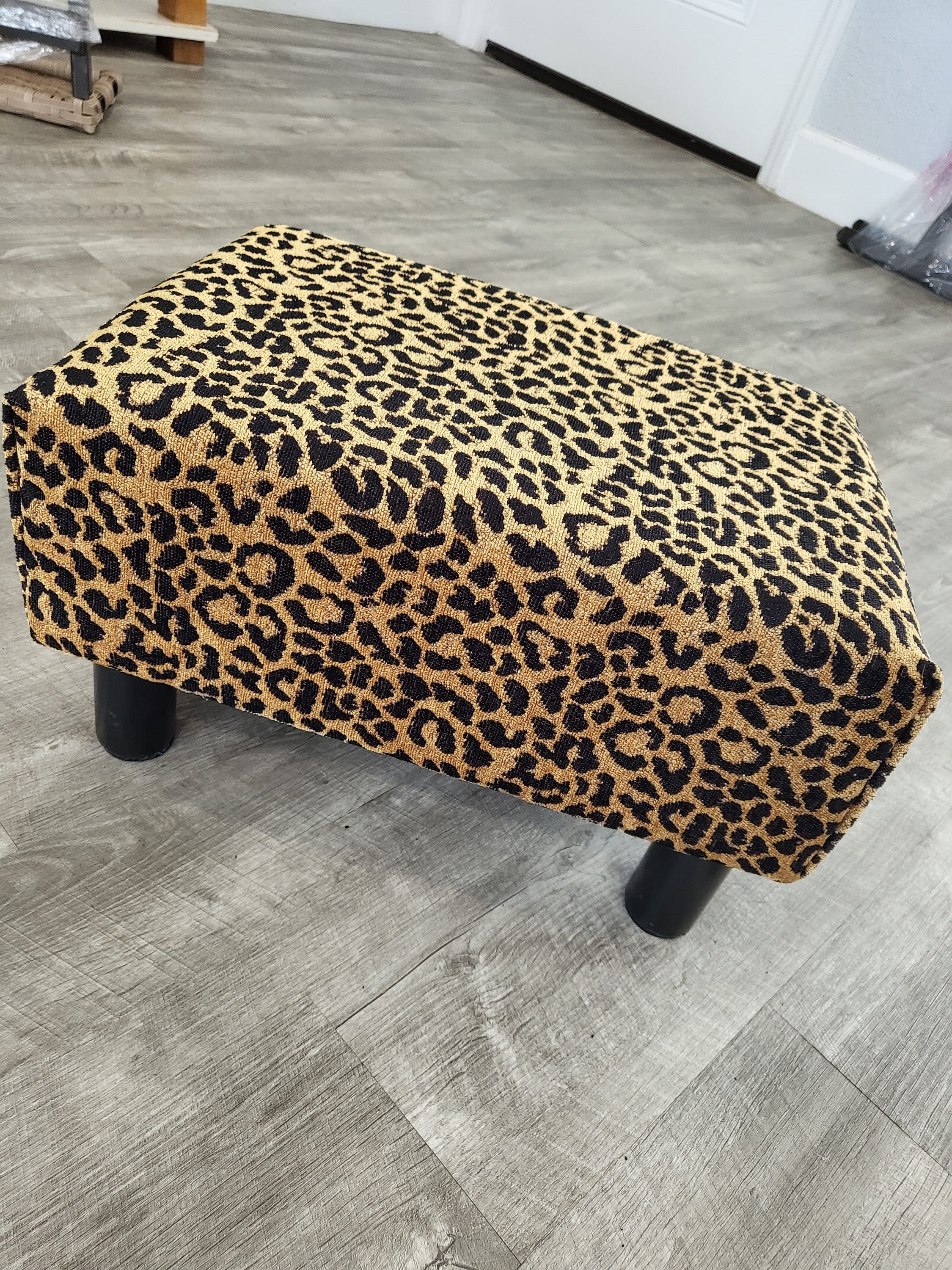 Ottoman Footrest with Short Black Legs and Animal Print Accent