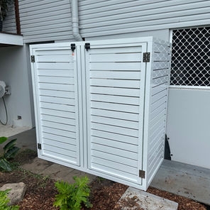 Outdoor Enclosure: Black Hardware Accents and White Slats
