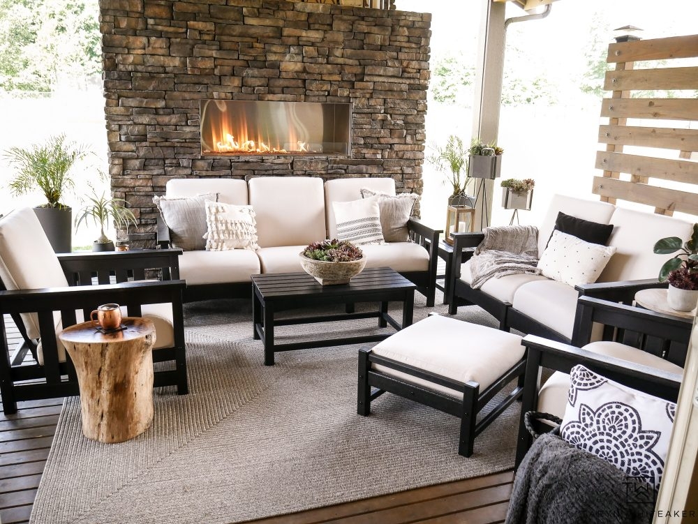 Outdoor Furniture Set featuring Stacked Stone Fireplace and Log Table