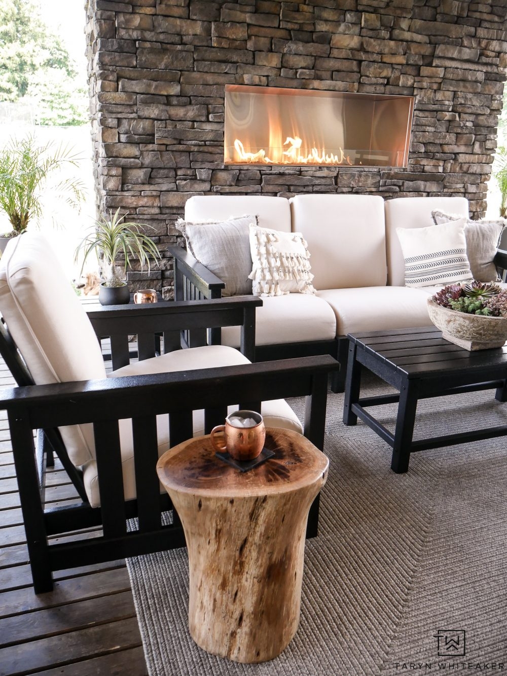 Outdoor Lounge Set featuring Natural Log Accent and Linear Fireplace