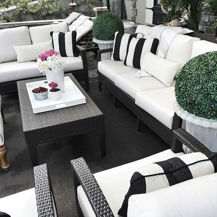 Outdoor Seating Set featuring Sculptural Topiaries and Striped Pillows