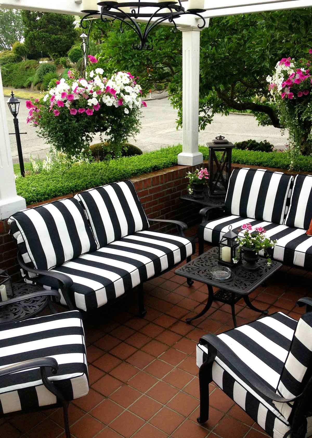 Outdoor Seating Set with Vertical Striped Cushions and Ornate Metal