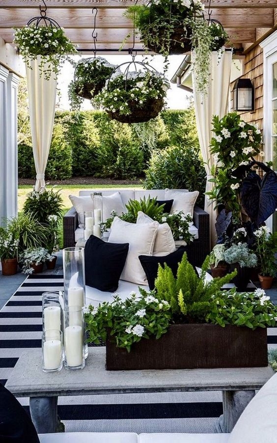 Outdoor Terrace with Hanging Baskets and Striped Rug Styling