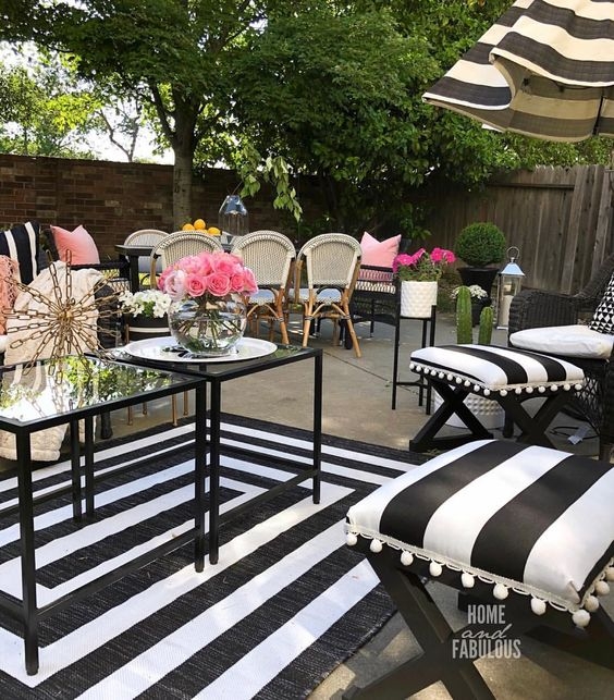 Patio Set featuring Striped Ottomans and White Pom Pom Fringe