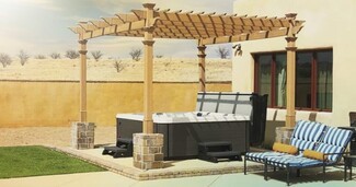Pergola with Stone Pillar Bases and Resort Style Design