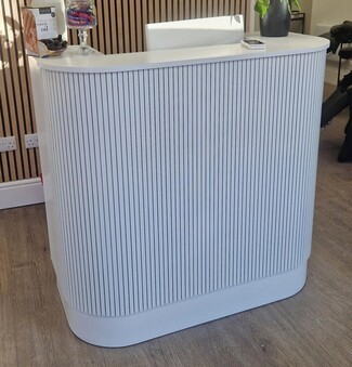 Reception Desk with Fluted Paneling and Curved U-Shape
