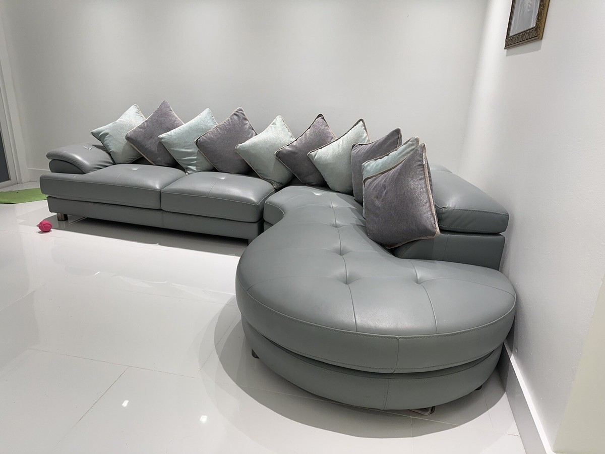 Sectional Sofa and Rounded Chaise with Button Tufted Seat Detail