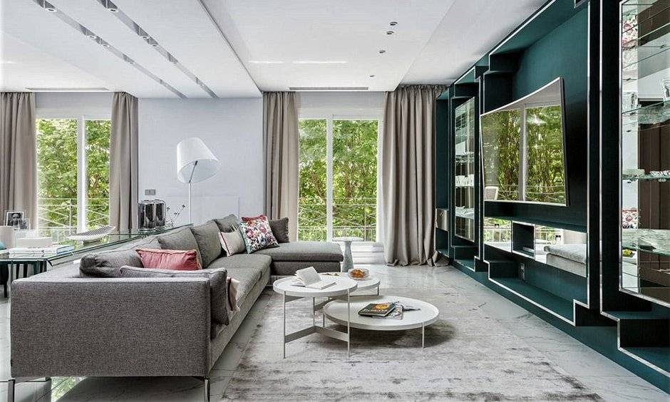 Sectional Sofa: Deep Teal Accent Wall and Nested Tables