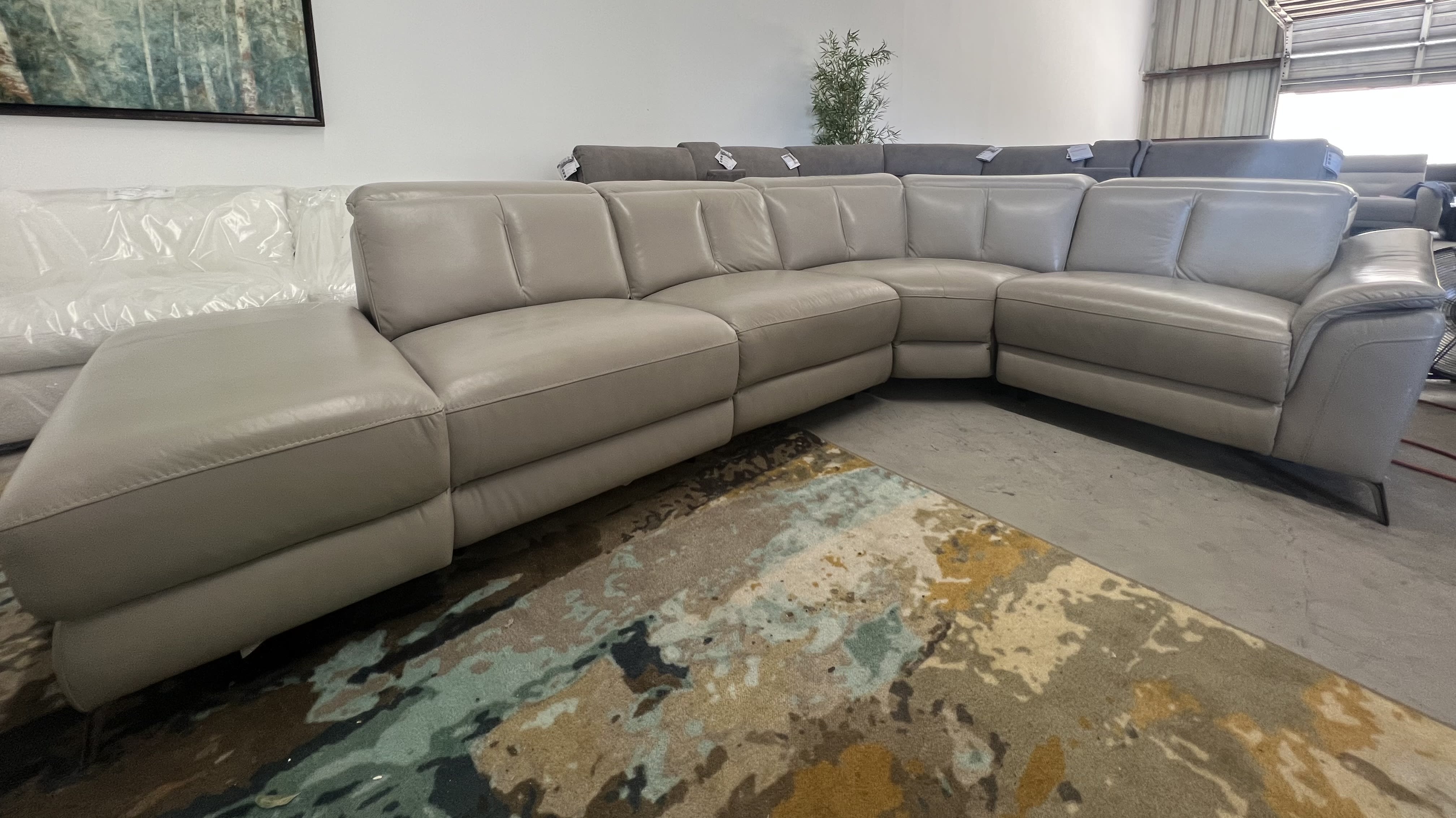 Sectional Sofa highlighting Curved Corner and Metal Stiletto Legs