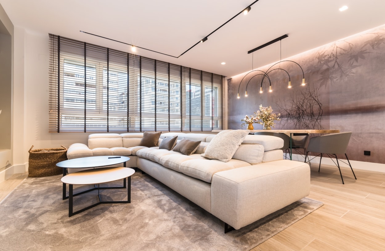 Sectional Sofa: Track Lighting Nested Coffee Table Cream Upholstery