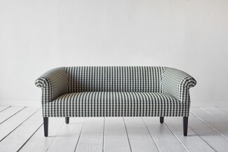Settee with Gingham Pattern and Transitional Low Back