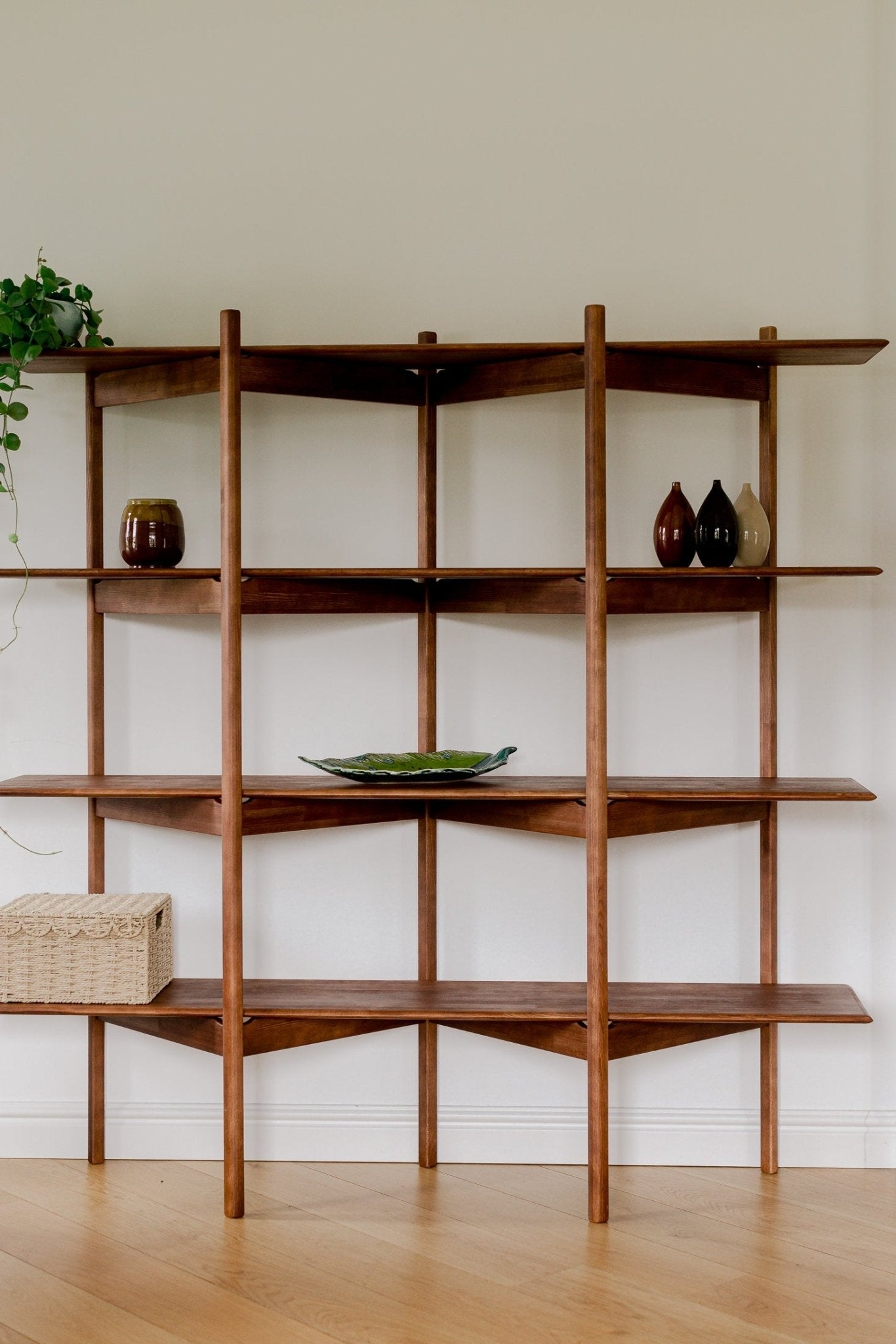 Shelving Unit: Cylindrical Supports Architectural Wood Bookshelf