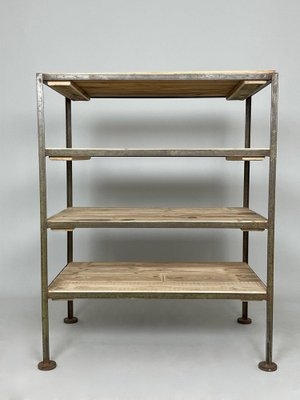 Shelving Unit with Slender Metal Frame and Circular Feet Rack