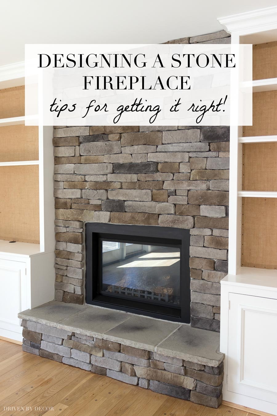 Stacked Stone Fireplace Flanking White Built-ins Design