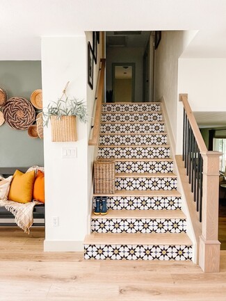 Staircase With Black Balusters: Industrial Farmhouse Entryway