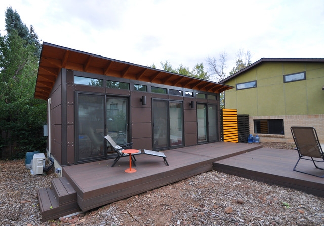 Studio Shed with Exposed Wood Rafters and Modular Siding