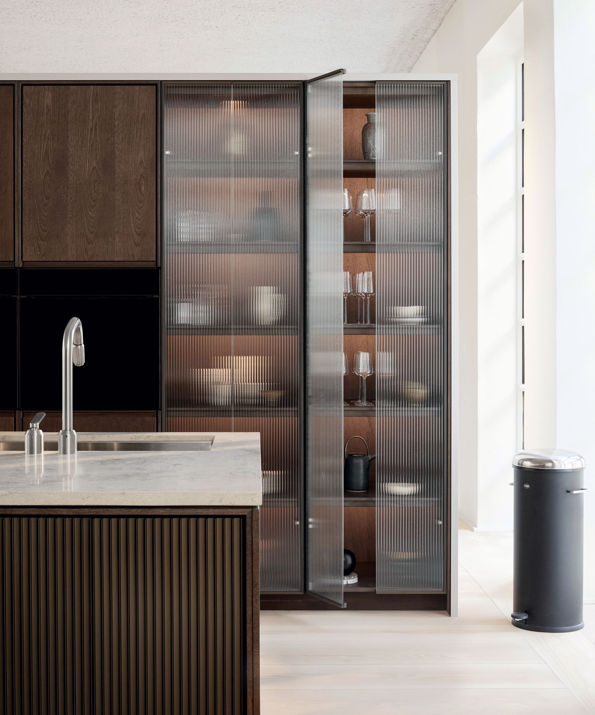 Tall Kitchen Cabinetry with Reeded Glass Pantry Doors