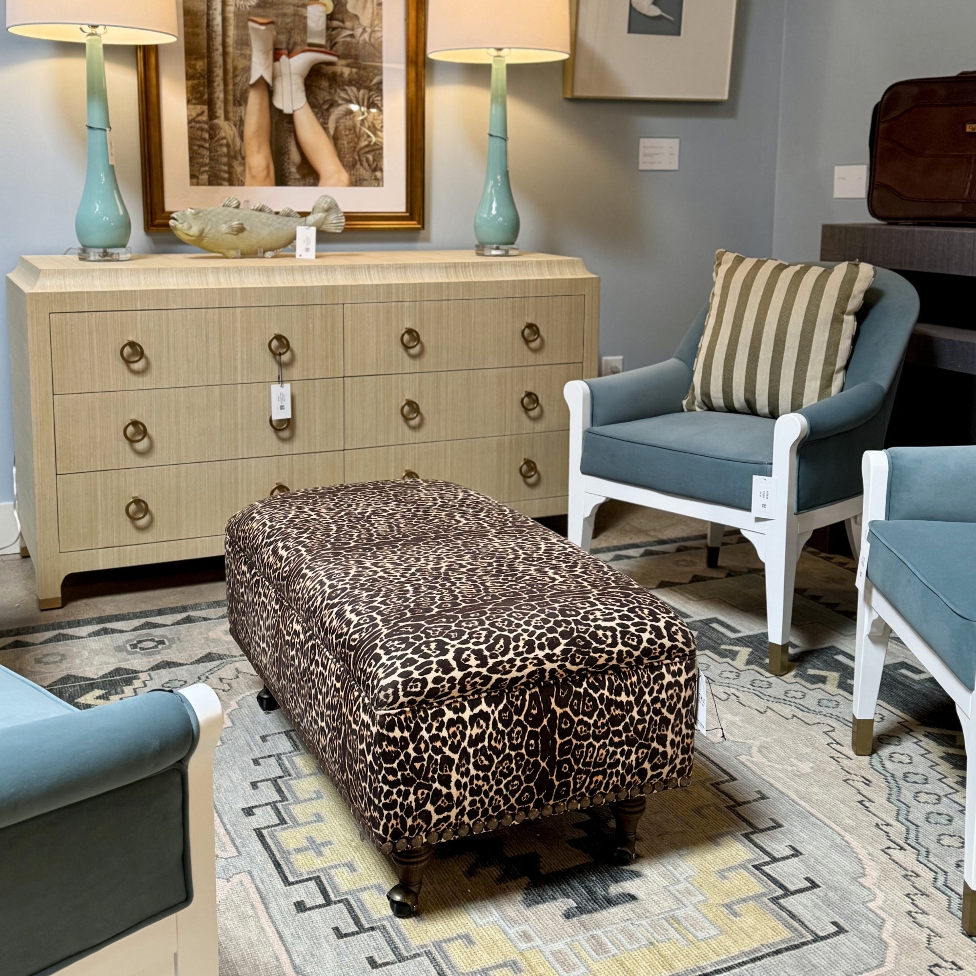 Upholstered Ottoman with Nailhead Trim and Classic Casters