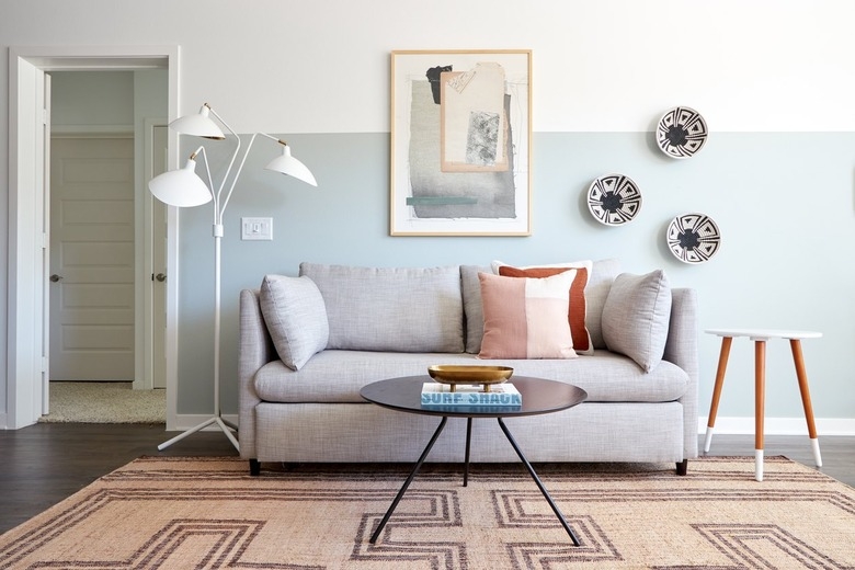 Upholstered Sofa: Geometric Jute Area Rug and Terracotta Accents