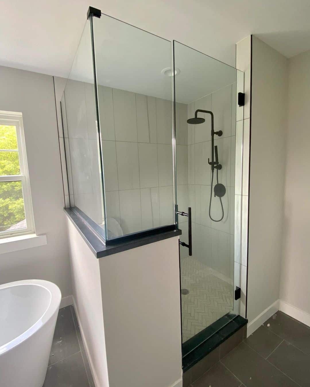 Walk In Shower pony wall design and contemporary shower