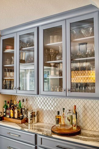 Wet Bar featuring Arabesque Tile and Blue Gray Cabinets