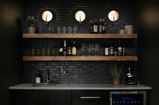 Wet Bar with Black Brick Tile and Thick Floating Shelves