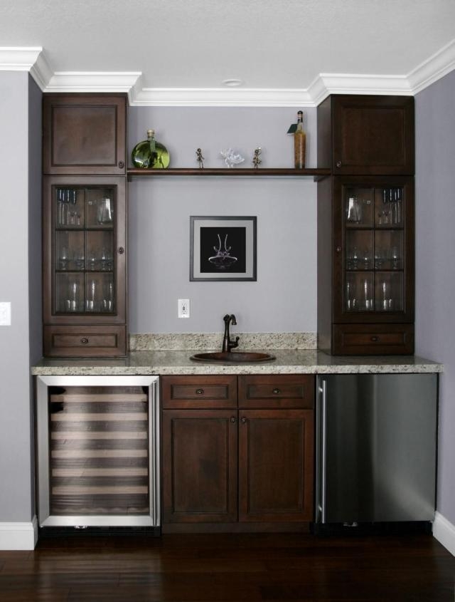 Wet Bar with Copper Toned Sink and Symmetrical Cabinets