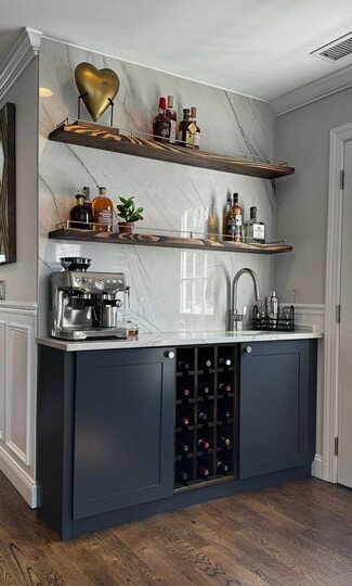 Wet Bar with Navy Shaker Cabinets and Marble Slab Backsplash
