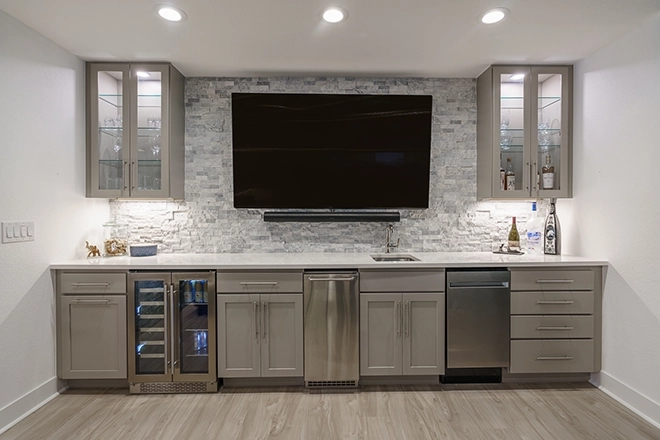 Wet Bar with Stacked Stone Backsplash and Mounted TV