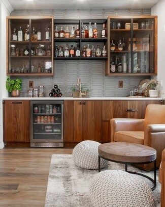 Wet Bar with Walnut Cabinetry and Geometric Backsplash