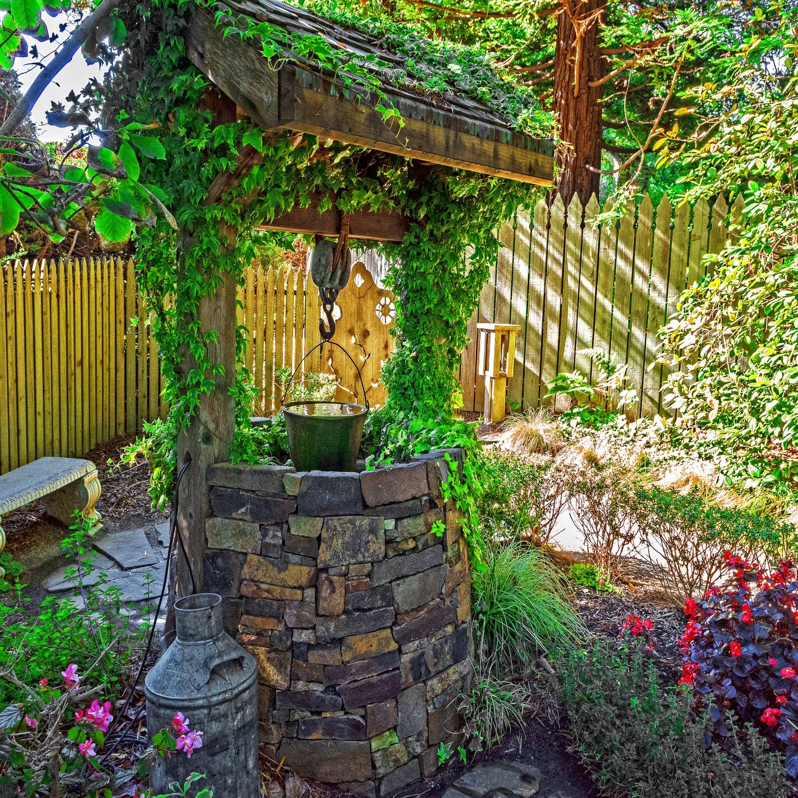 Wishing Well featuring an Ivy Covered Roof and Fieldstone Masonry