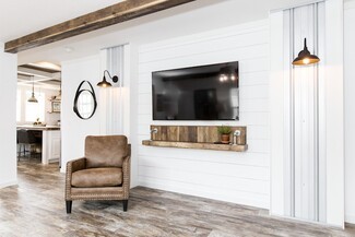 Accent Chair with Corrugated Metal and Farmhouse Style Wall
