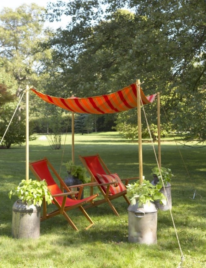 Backyard Canopy: Milk Can Planters for Striped Garden Canopy Setup