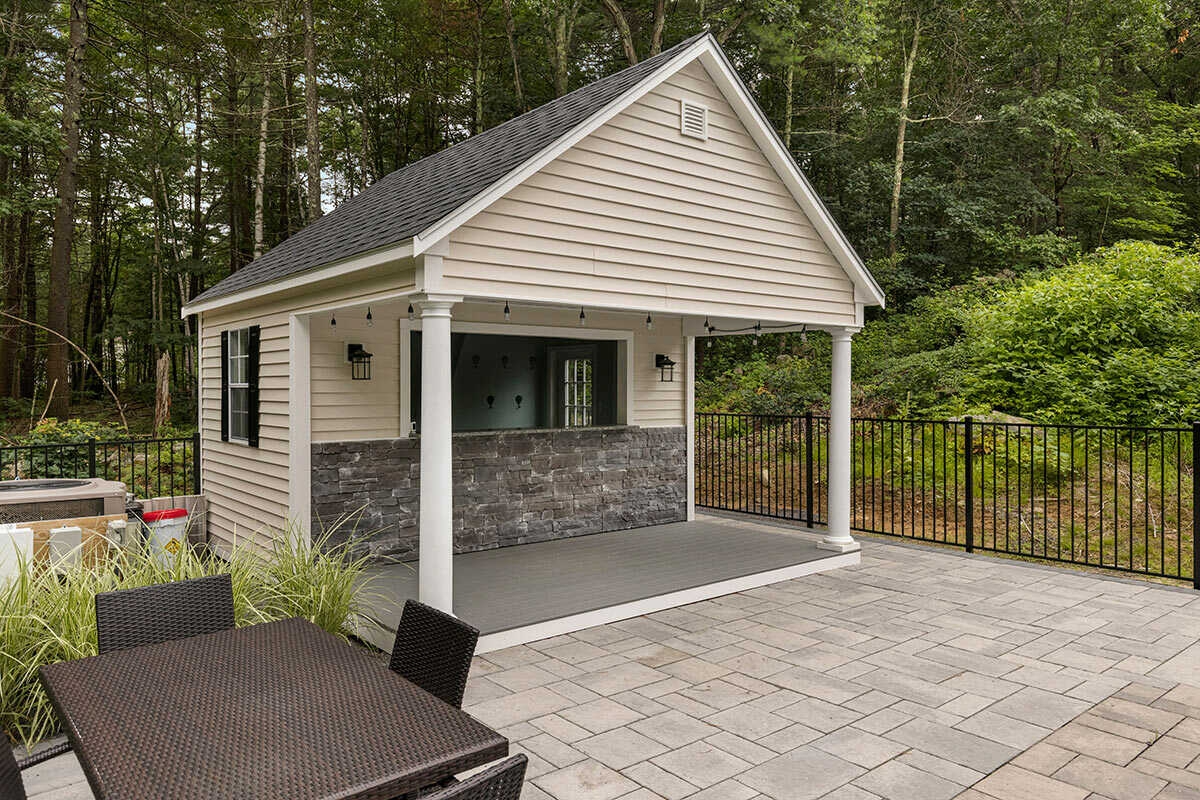 Bar Shed Stone Veneer Front with White Tapered Columns