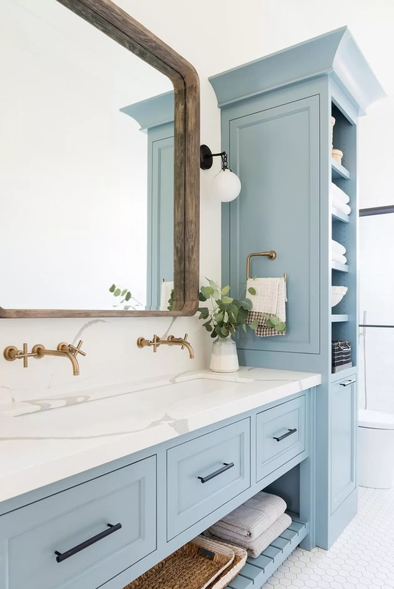 Bathroom Vanity with Wall Mounted Faucets and Dusty Blue Decor