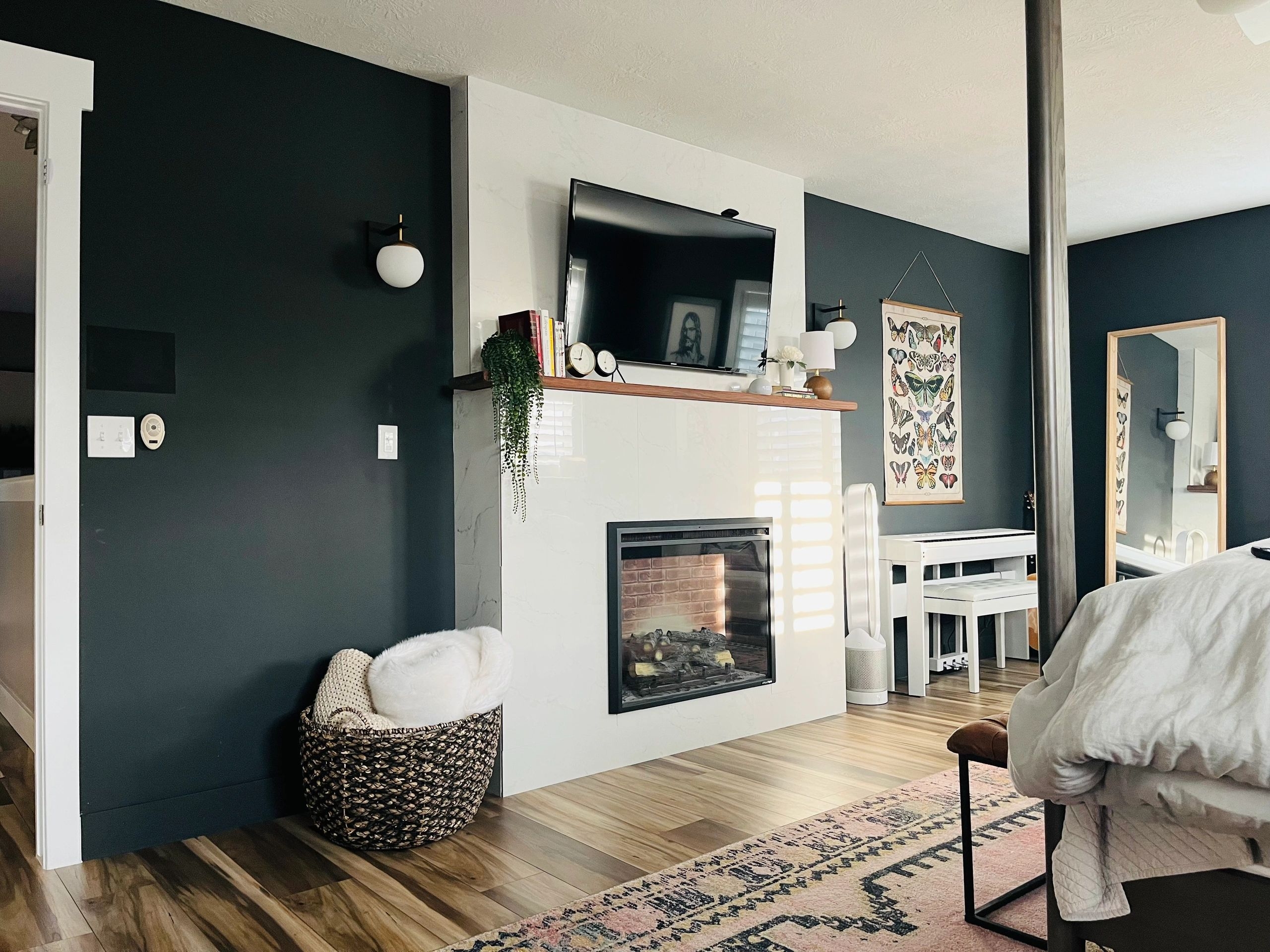 Built-in Fireplace: Marble Look Surround and Charcoal Wall Contrast