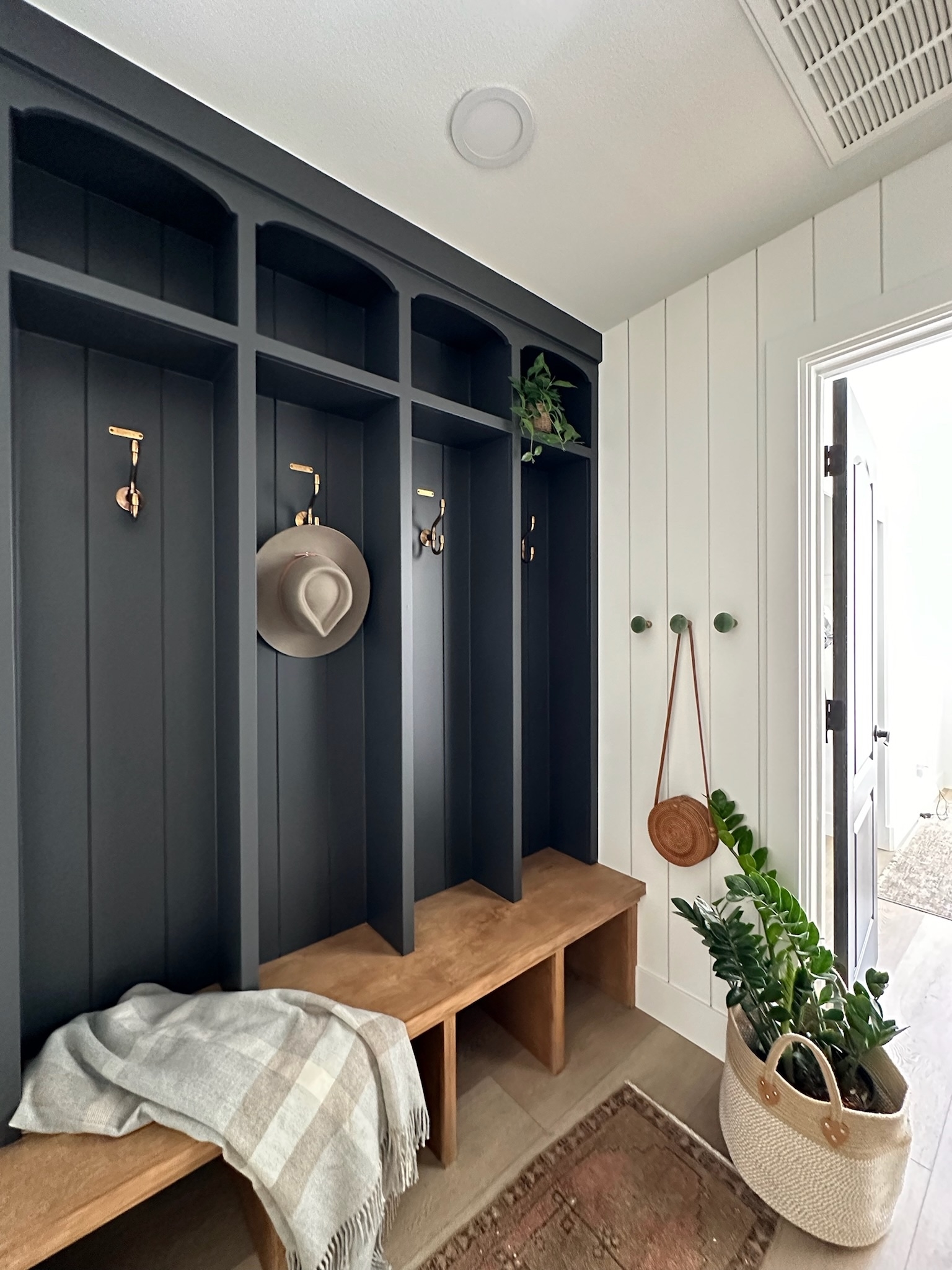 Built In Mudroom: Arched Locker Mudroom with Charcoal Cabinetry