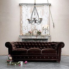 Chesterfield Sofa: Chocolate Velvet and Distressed Backdrop
