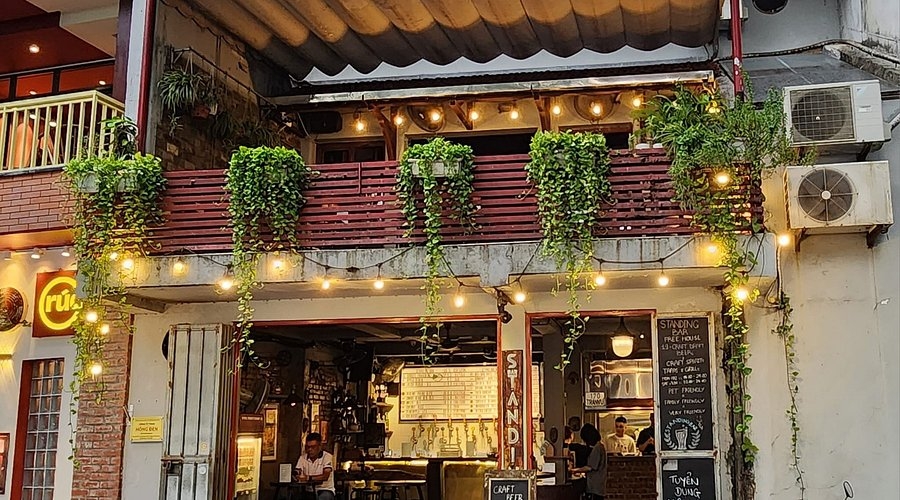 Commercial Facade with Cascading Greenery and Metal